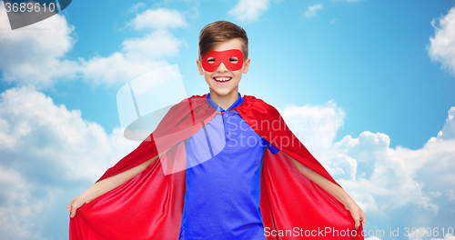 Image of boy in red super hero cape and mask