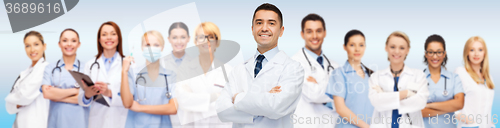 Image of group of smiling doctors with clipboard