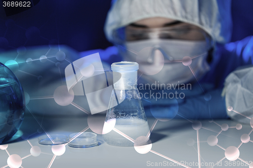 Image of close up of scientist making test in lab