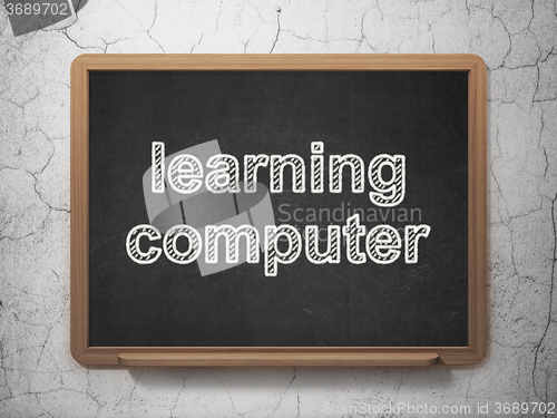 Image of Education concept: Learning Computer on chalkboard background