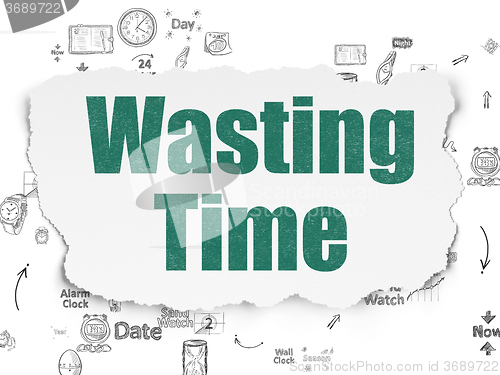 Image of Time concept: Wasting Time on Torn Paper background