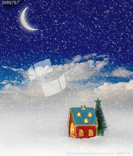 Image of Christmas festive light in house under blue sky