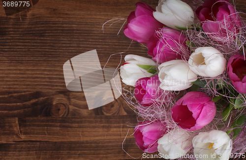 Image of tulip bouquet on wood background