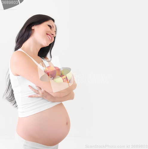 Image of pregnant woman with fruits