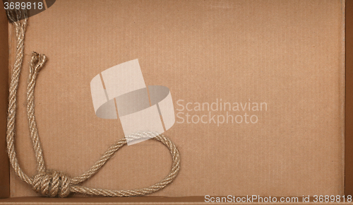 Image of Rope on cardboard texture background