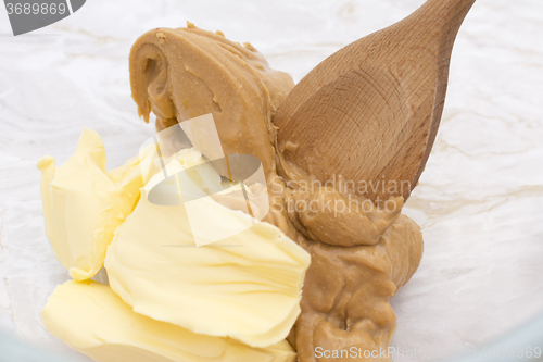 Image of Mixing pats of butter and peanut butter 