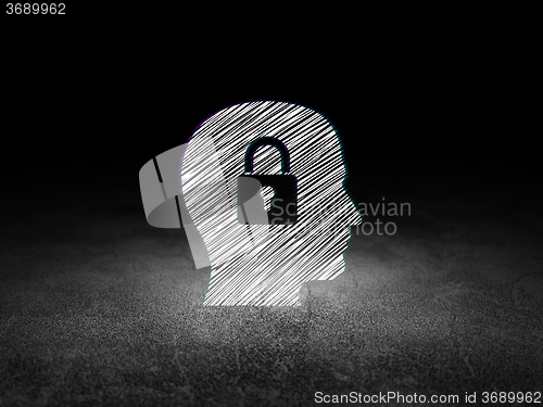 Image of Information concept: Head With Padlock in grunge dark room