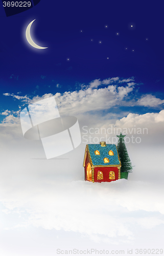 Image of Christmas festive light in house under blue sky