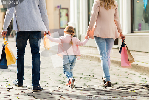 Image of close up of family with child shopping in city