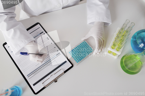 Image of close up of scientist making test in lab