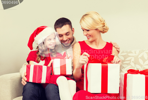 Image of happy family opening gift boxes