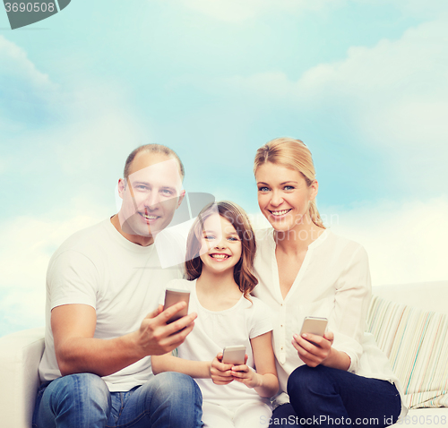 Image of happy family with smartphones