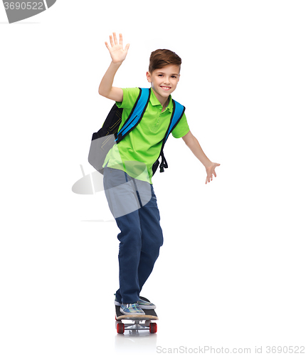 Image of happy student boy with backpack and skateboard