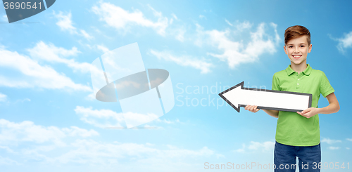 Image of happy boy holding white blank arrow banner