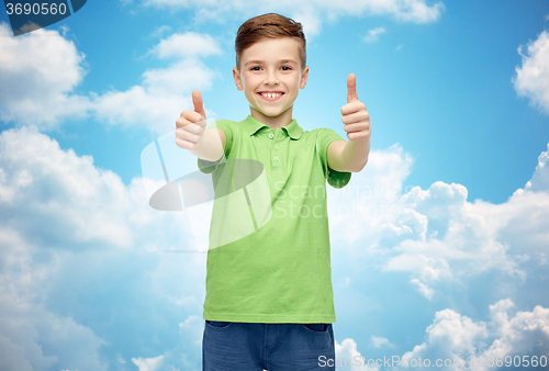 Image of happy boy in green polo t-shirt showing thumbs up