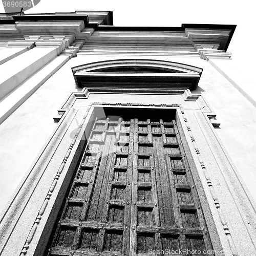 Image of  entrance   door    in italy   ancian wood and traditional  text