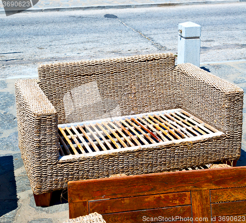 Image of wicker sofa  in santorini europe greece old restaurant chair and