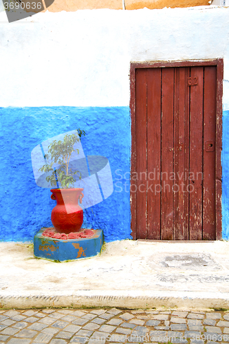 Image of historical blue  in  antique building door morocco      style af