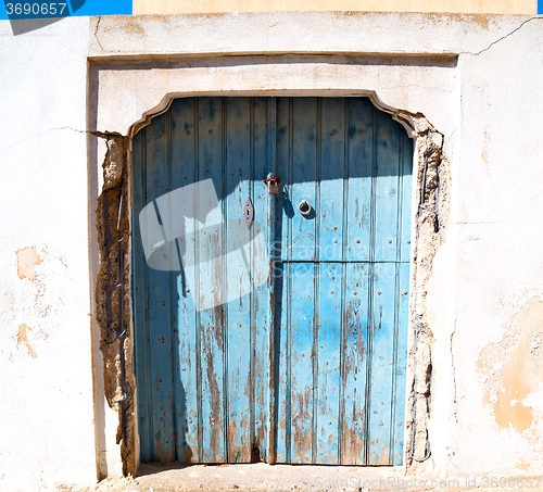 Image of blue door in antique village santorini greece europe and    whit