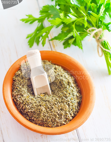 Image of Dry parsley in the bowl, green parsley