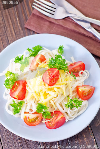 Image of pasta with cheese and tomato