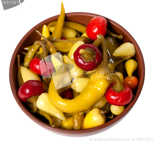 Image of Mix of hot turkish marinated peppers in ceramic bowl