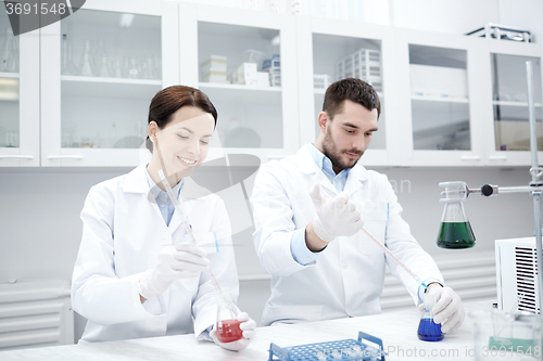 Image of young scientists making test or research in lab