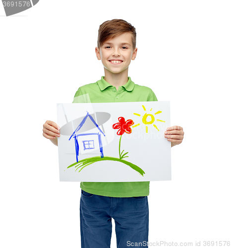 Image of happy boy holding drawing or picture of home