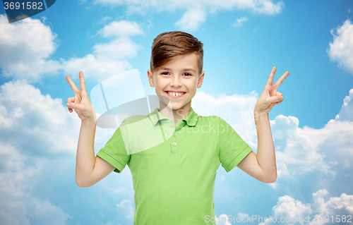 Image of happy boy showing peace or victory hand sign