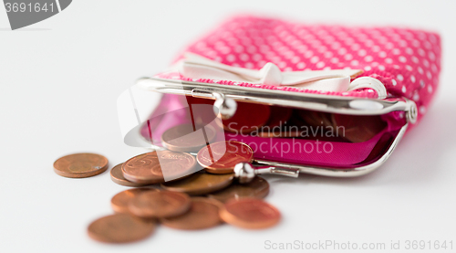 Image of close up of euro coins and open wallet on table