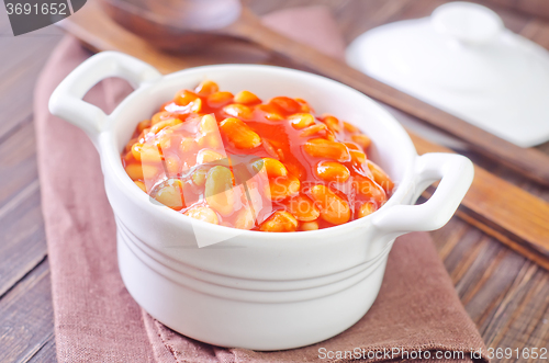 Image of white beans with tomato sauce