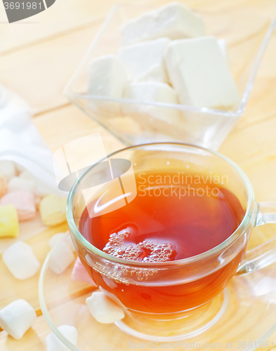 Image of Fresh tea with candy