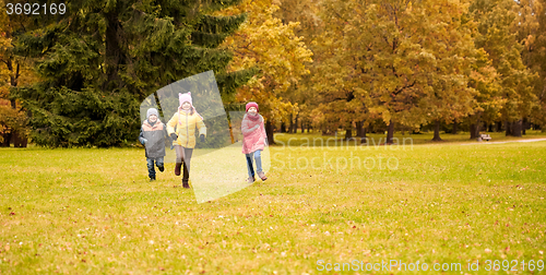 Image of group of happy little kids running outdoors