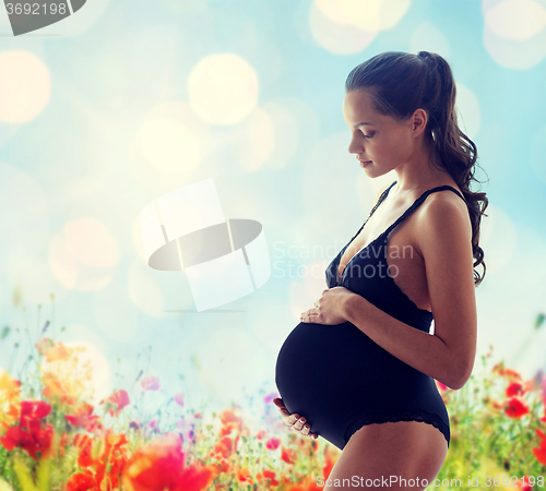 Image of happy pregnant woman in black underwear