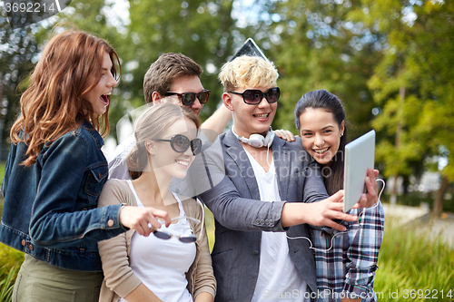 Image of students or teenagers with tablet pc taking selfie