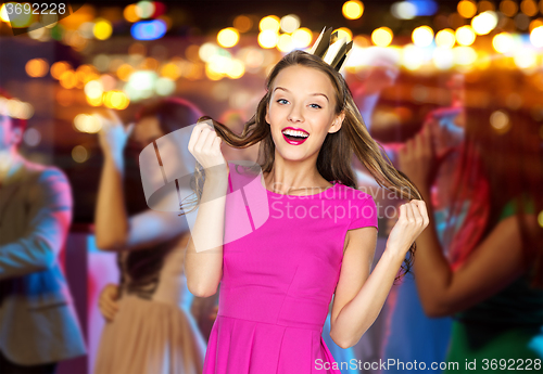 Image of happy young woman or teen girl in pink dress