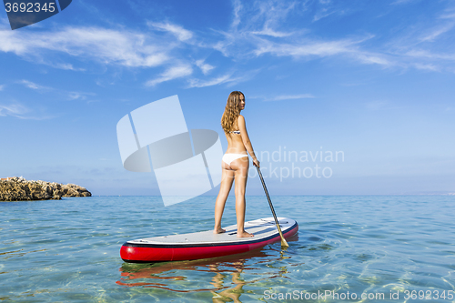 Image of Woman practicing paddle