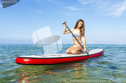 Image of Woman practicing paddle