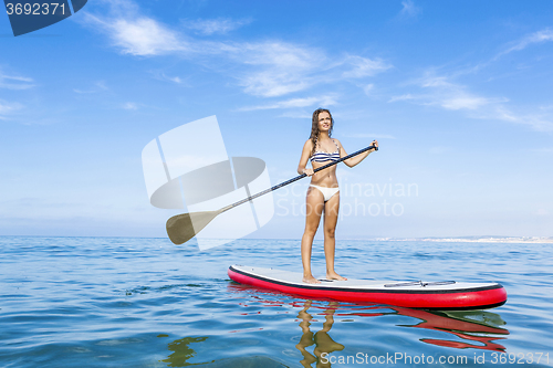 Image of Woman practicing paddle