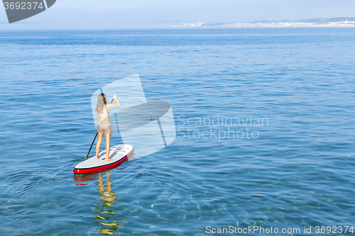 Image of Woman practicing paddle