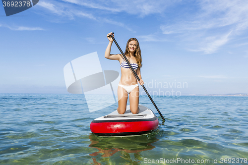 Image of Woman practicing paddle