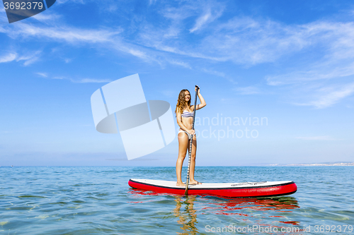 Image of Woman practicing paddle