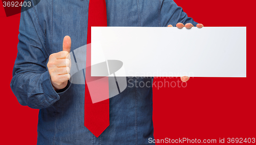 Image of man holding a sign