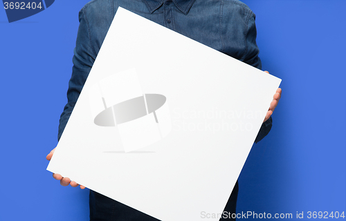 Image of man holding a sign