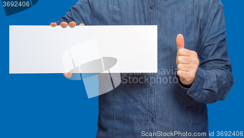 Image of man holding a sign