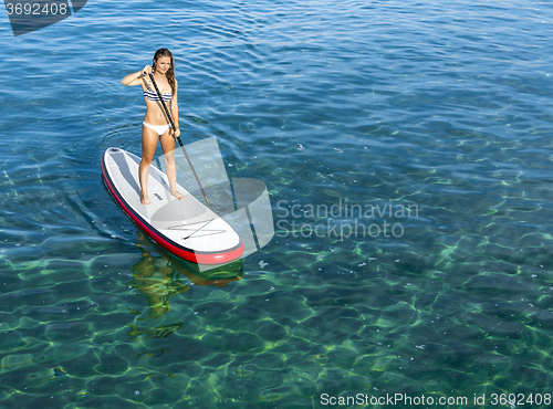 Image of Woman practicing paddle