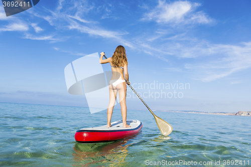 Image of Woman practicing paddle