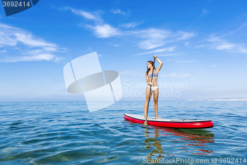 Image of Woman practicing paddle