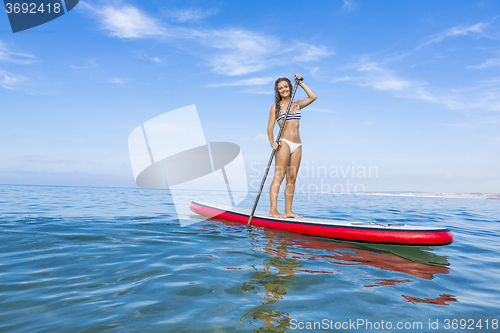 Image of Woman practicing paddle