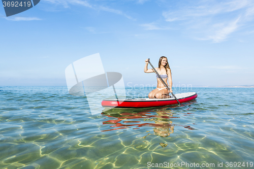 Image of Woman practicing paddle